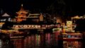 Qin Huai River side. Showing traditional buildings with the lights reflection in the dark.